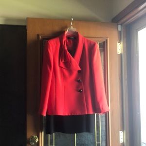 Two piece skirt suit.